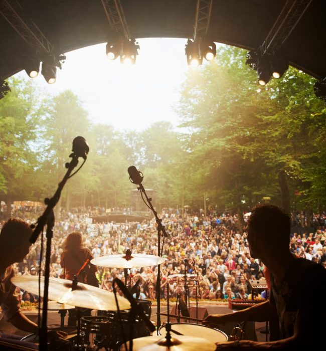 Ready to rock. Cropped shot of a musicians feet on stage at an outdoor music festival